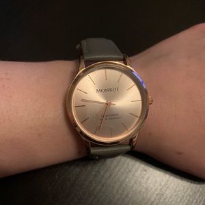 Monroe rose gold watch with a gray band